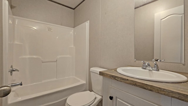 full bathroom featuring vanity, crown molding, shower / tub combination, and toilet