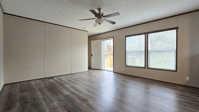 unfurnished room featuring crown molding, ceiling fan, plenty of natural light, and hardwood / wood-style floors