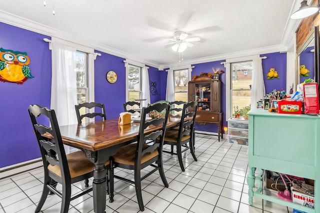 dining room with crown molding and light tile patterned floors