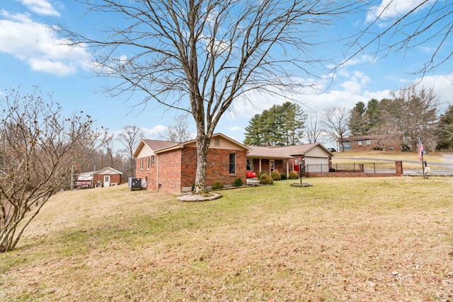 view of front of property with a garage and a front yard