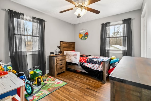 bedroom featuring wood-type flooring and ceiling fan