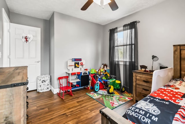 bedroom featuring dark wood-type flooring and ceiling fan