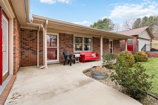 view of patio / terrace featuring a garage