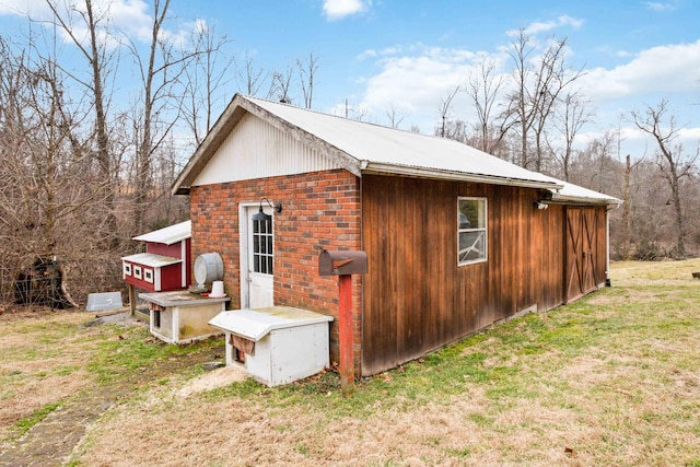 view of property exterior featuring a lawn