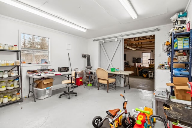 office space featuring plenty of natural light, a workshop area, and concrete floors