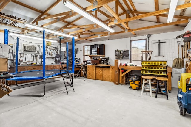 interior space featuring a trampoline and a workshop area