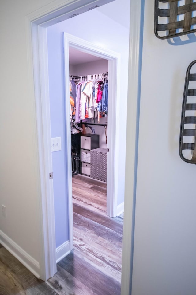 corridor featuring hardwood / wood-style flooring