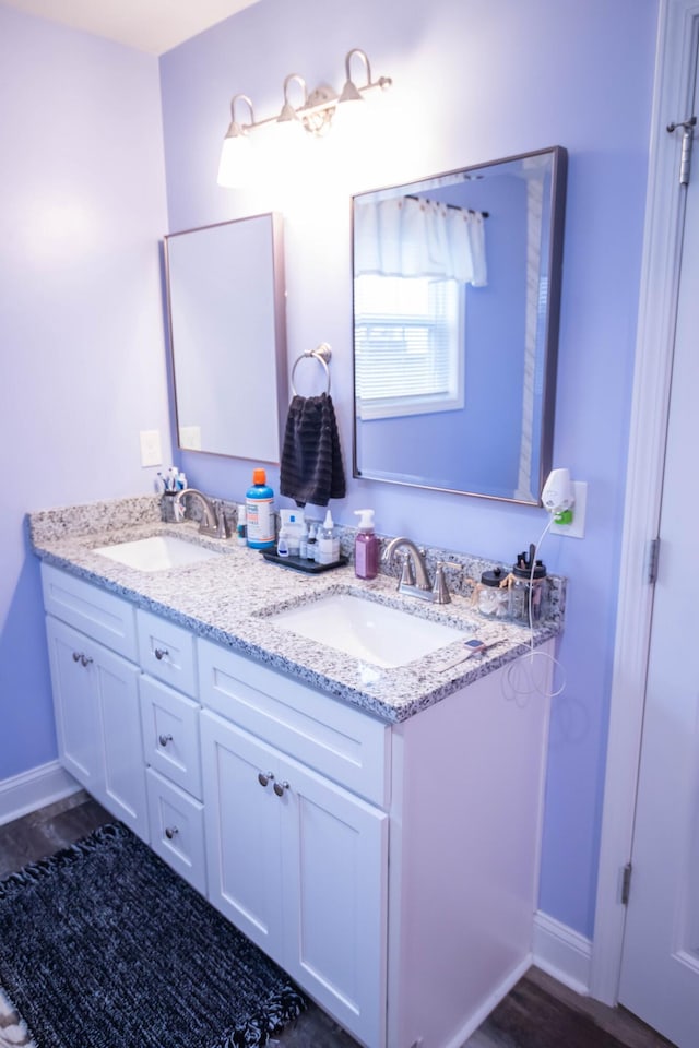 bathroom featuring vanity and hardwood / wood-style floors