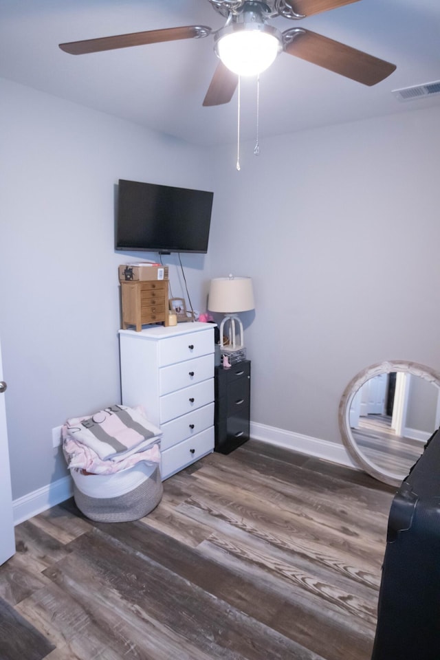 bedroom featuring dark hardwood / wood-style flooring and ceiling fan