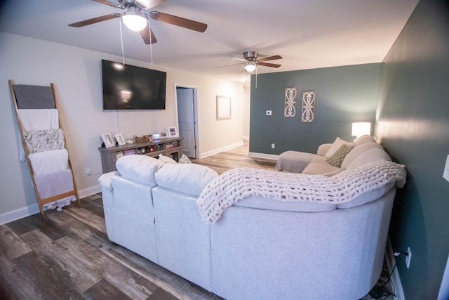 living room featuring wood-type flooring and ceiling fan