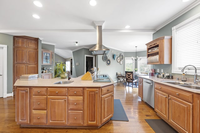 kitchen with decorative light fixtures, dishwasher, sink, and a center island with sink