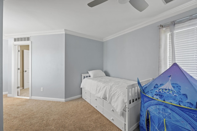 carpeted bedroom with crown molding and ceiling fan