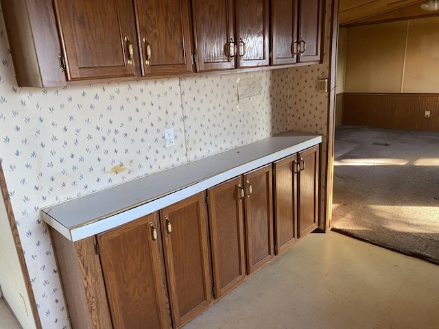 kitchen with light colored carpet