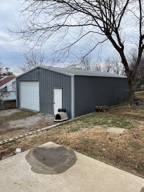 view of outbuilding with a garage