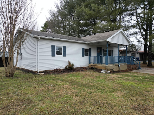 ranch-style house with covered porch and a front yard