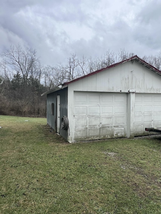 garage featuring a yard