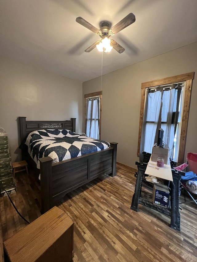 bedroom with hardwood / wood-style flooring and ceiling fan