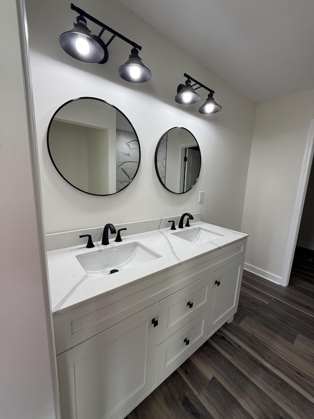 bathroom featuring wood-type flooring and vanity