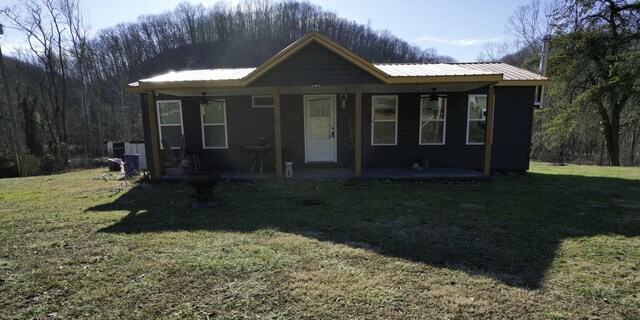 view of front of home with a front yard and covered porch