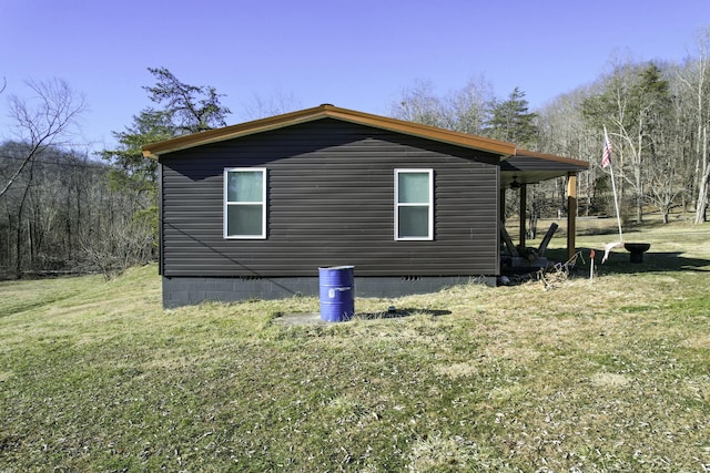 view of property exterior featuring a lawn