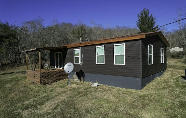 rear view of property with a yard