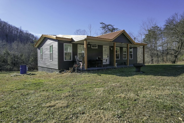 view of front of home featuring a front yard and covered porch