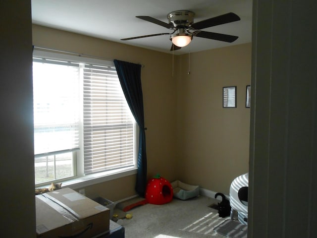 miscellaneous room featuring ceiling fan and carpet flooring