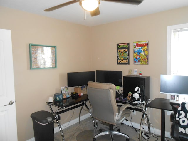 office with carpet floors and ceiling fan