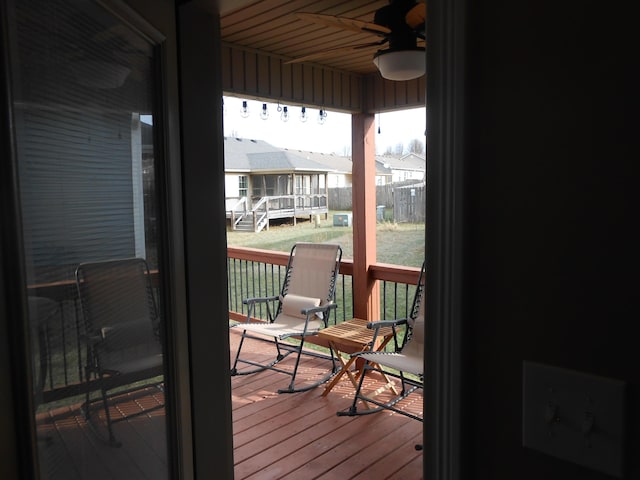 exterior space featuring a wooden deck and ceiling fan