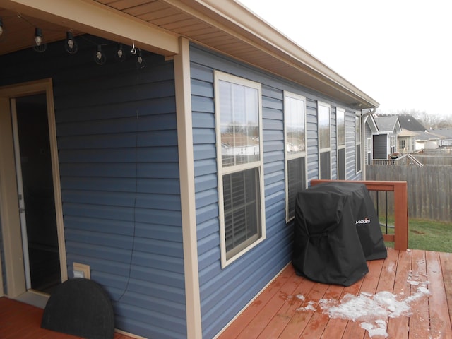 wooden terrace with a grill