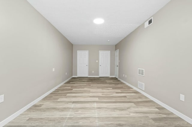 foyer entrance with light wood-type flooring