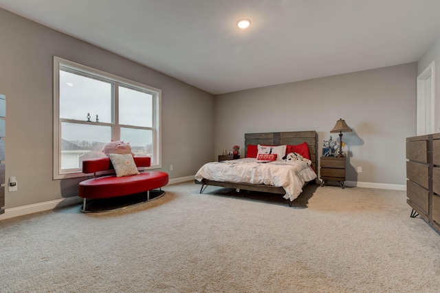 bedroom with carpet flooring and baseboards