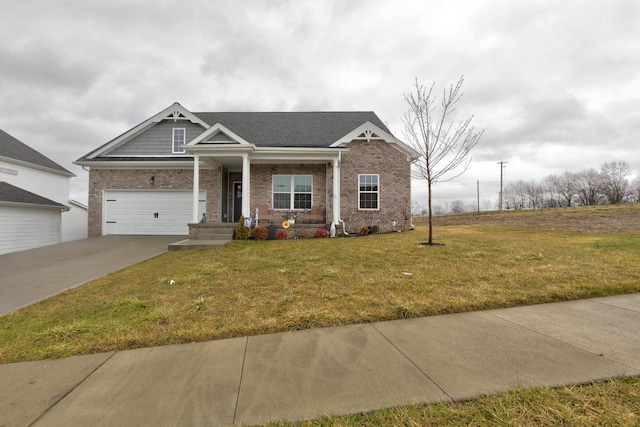 craftsman house with concrete driveway, a front lawn, an attached garage, and brick siding