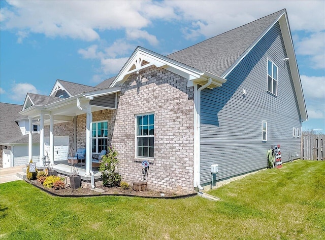 102 Nuthatch Trl, Georgetown, KY 40324 - view of side of home featuring a yard, covered porch, and a shingled roof
