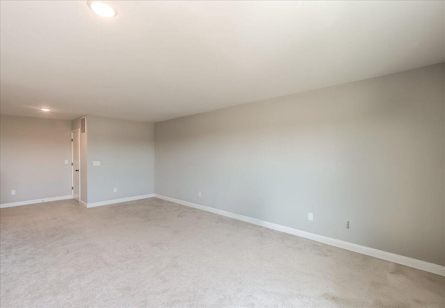 unfurnished room with light carpet, baseboards, and recessed lighting
