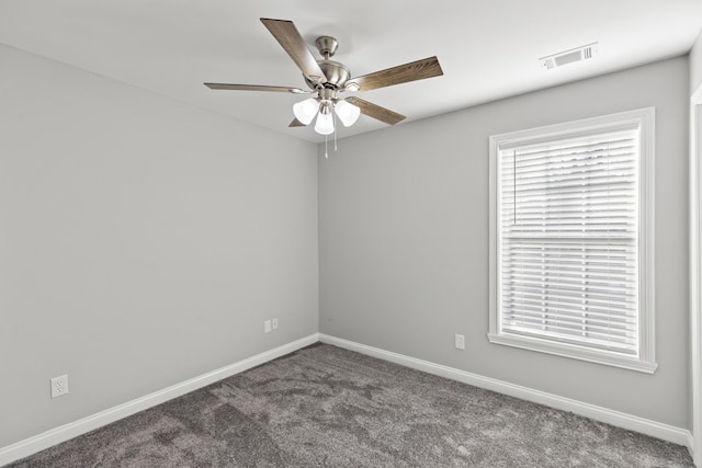 carpeted empty room featuring ceiling fan