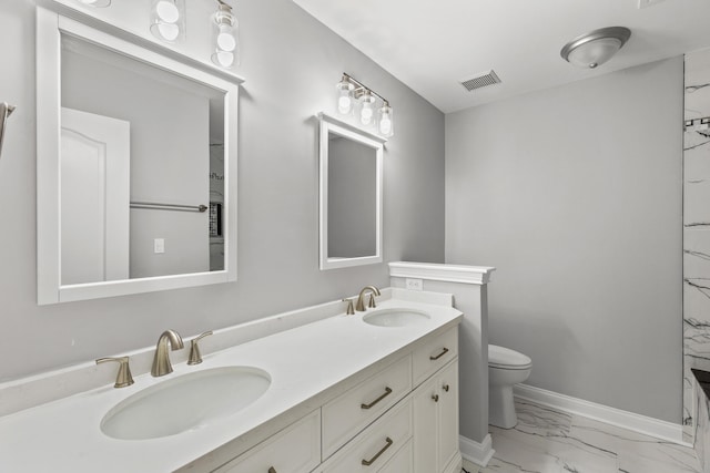 bathroom with vanity and toilet