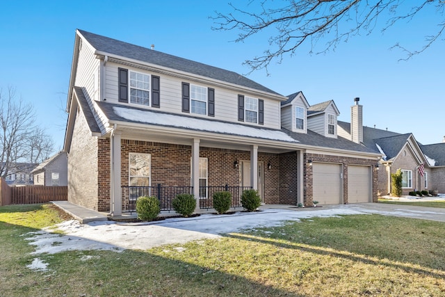 view of front facade with a porch, a garage, and a front lawn