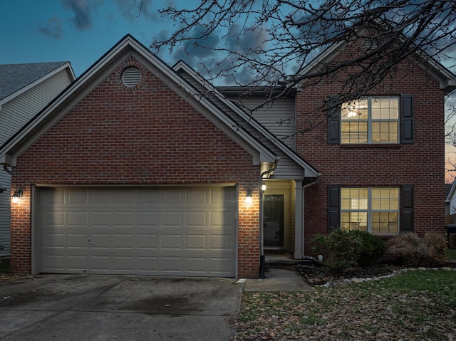 front of property with a garage