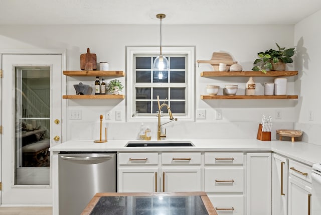 bar featuring white cabinetry, sink, decorative light fixtures, and dishwasher