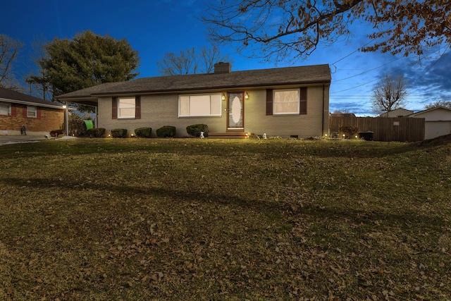 ranch-style home with a front lawn
