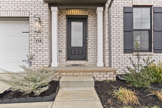 property entrance with a garage