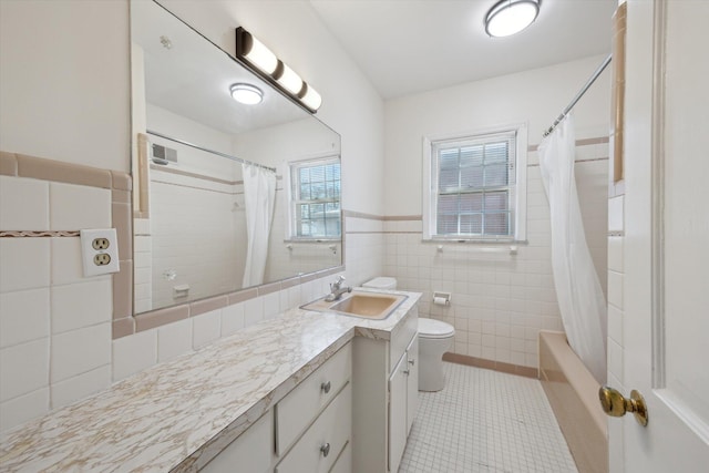 1952-1954 Fontaine Rd, Lexington, KY 40502 - bathroom with tile patterned flooring, vanity, tile walls, toilet, and visible vents