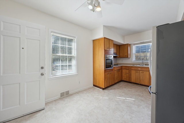 1952-1954 Fontaine Rd, Lexington, KY 40502 - kitchen featuring light countertops, visible vents, stainless steel appliances, a ceiling fan, and a sink