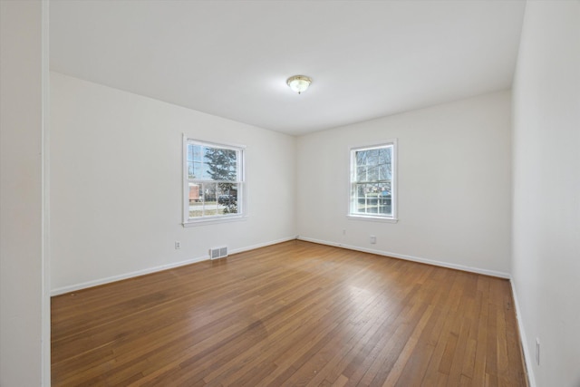 1952-1954 Fontaine Rd, Lexington, KY 40502 - empty room with hardwood / wood-style floors, baseboards, and visible vents