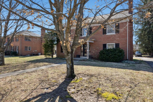 1952-1954 Fontaine Rd, Lexington, KY 40502 - colonial inspired home featuring brick siding and a front yard
