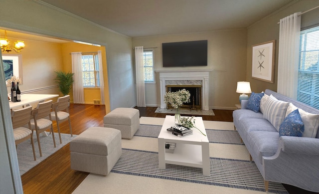 1952-1954 Fontaine Rd, Lexington, KY 40502 - living room featuring a fireplace, wood finished floors, a chandelier, and plenty of natural light