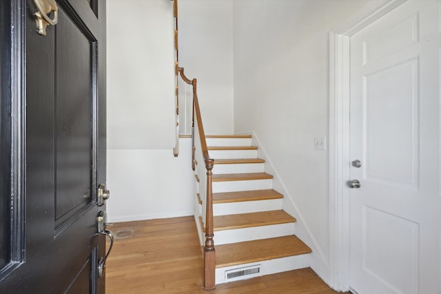 1952-1954 Fontaine Rd, Lexington, KY 40502 - foyer entrance with baseboards, stairs, visible vents, and wood finished floors