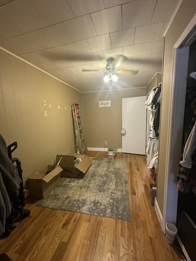 interior space featuring ceiling fan and wood finished floors