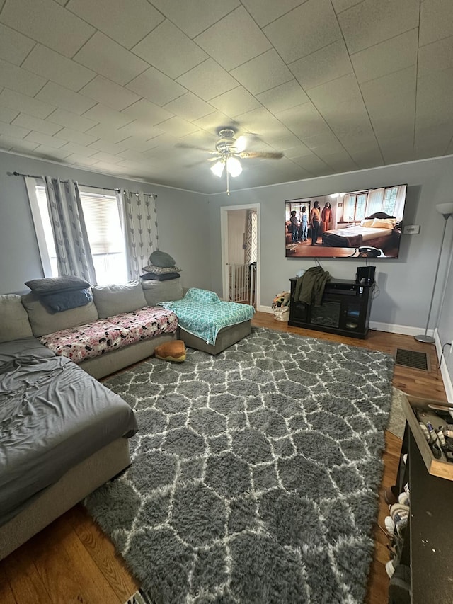 bedroom with hardwood / wood-style flooring and ceiling fan